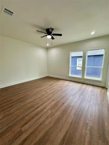 a bathroom with a double vanity sink toilet and shower