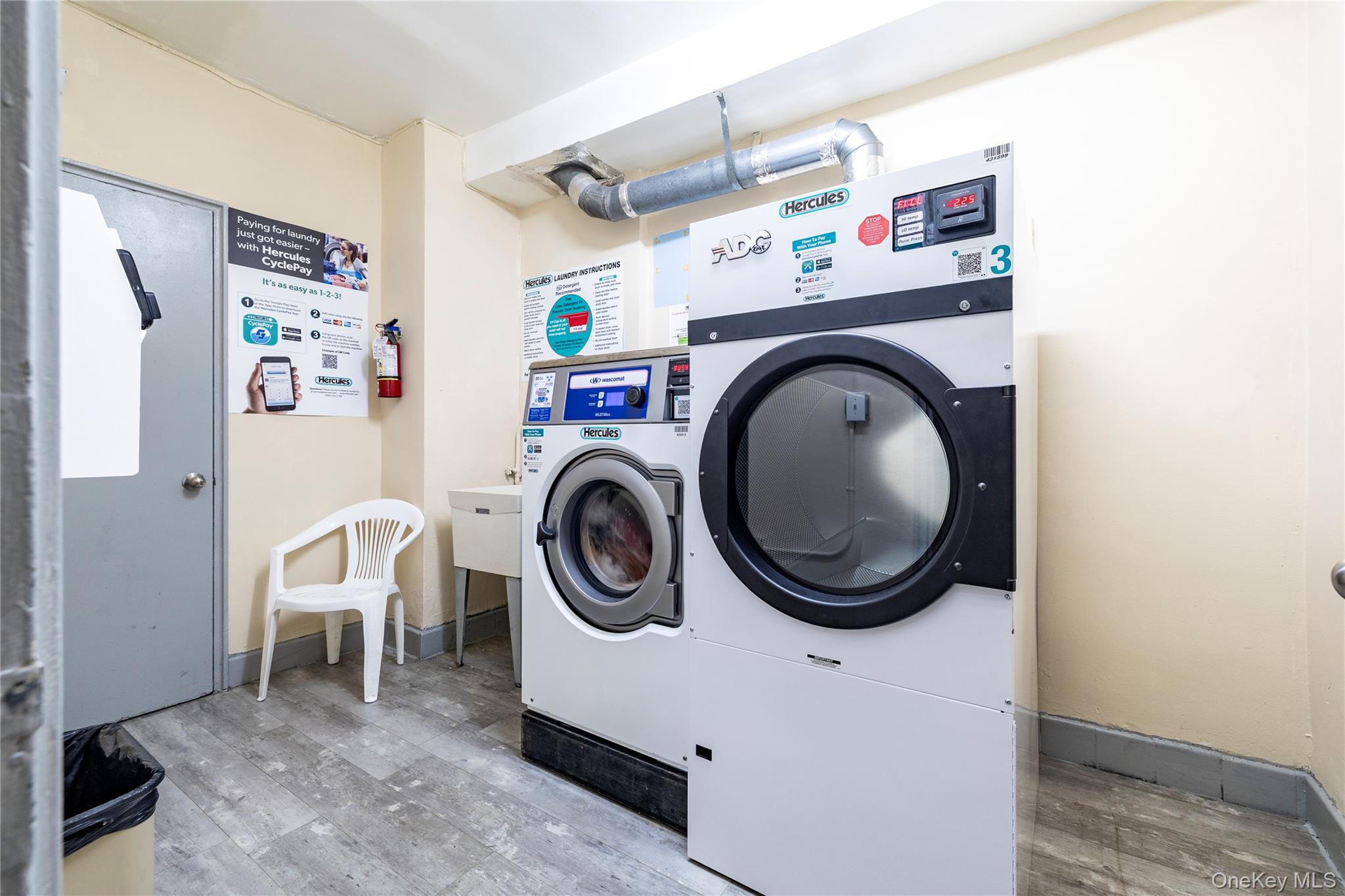 250 West Merrick Road, Unit 1E Freeport, NY 11520 - Photo 17 of 23 Hallway laundry room.