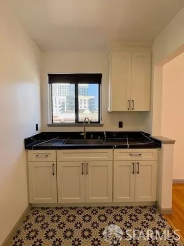 a bathroom with a sink toilet and mirror