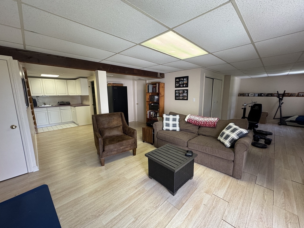38 Crescent Road, Unit 38 Needham, MA 02494 - Photo 14 of 23 a living room with furniture and a wooden floor