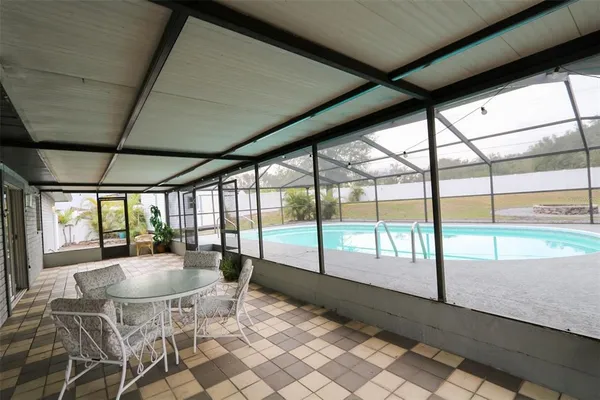 a view of a swimming pool with a patio
