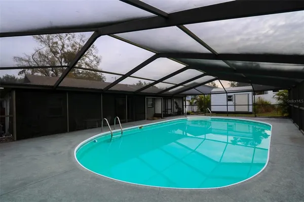 a view of a swimming pool with an outdoor space