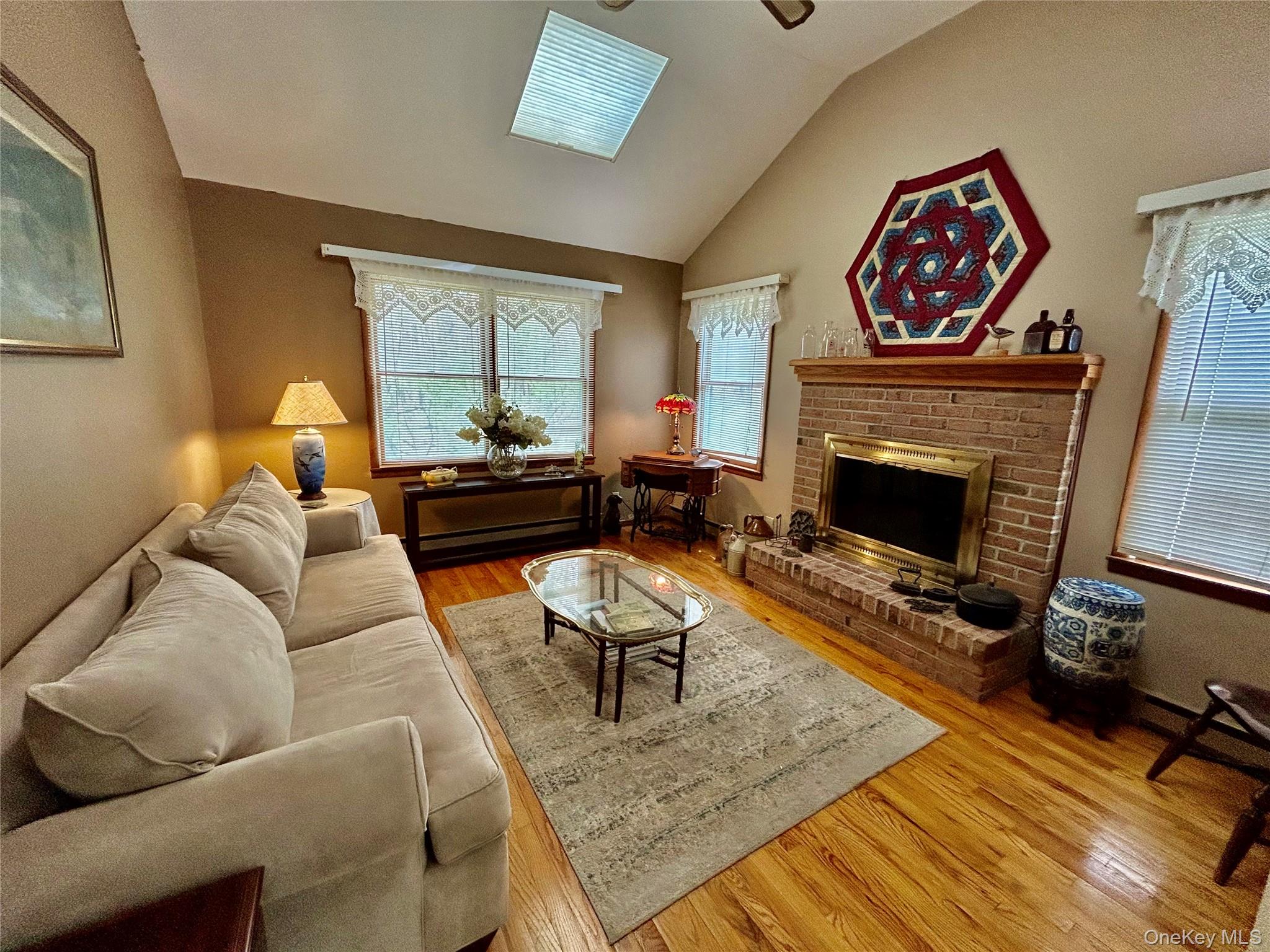 520 Cranston Lane Ridge, NY 11961 - Photo 11 of 18 Family rm with fireplace,Hardwood flooring and vaulted ceilings
