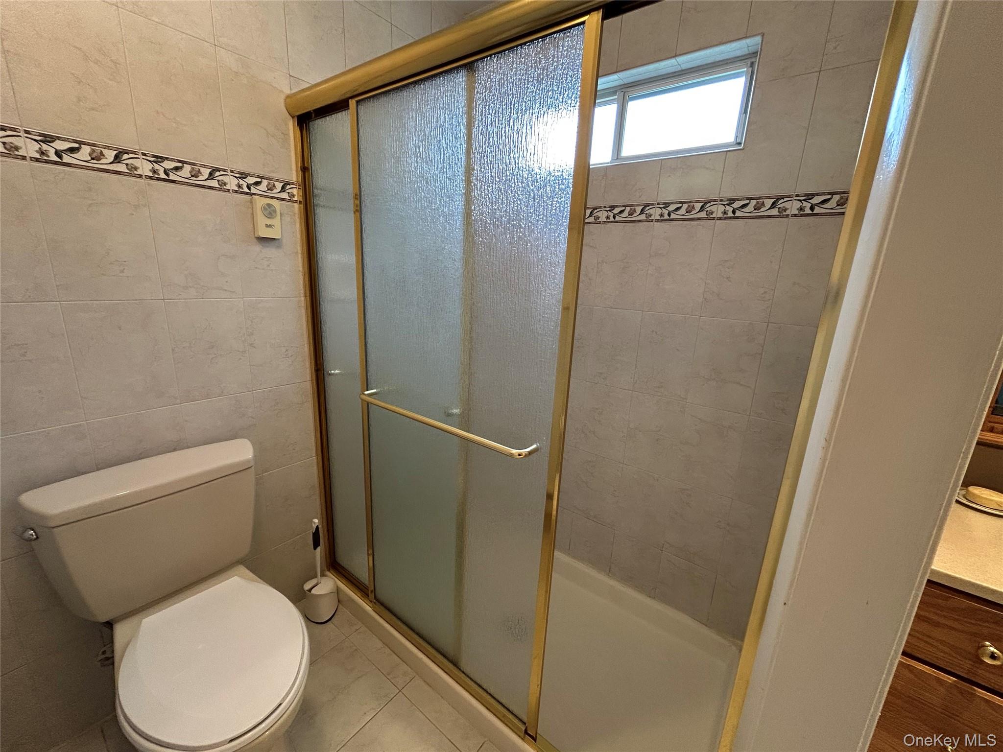 520 Cranston Lane Ridge, NY 11961 - Photo 15 of 18 Tile enclosed shower.