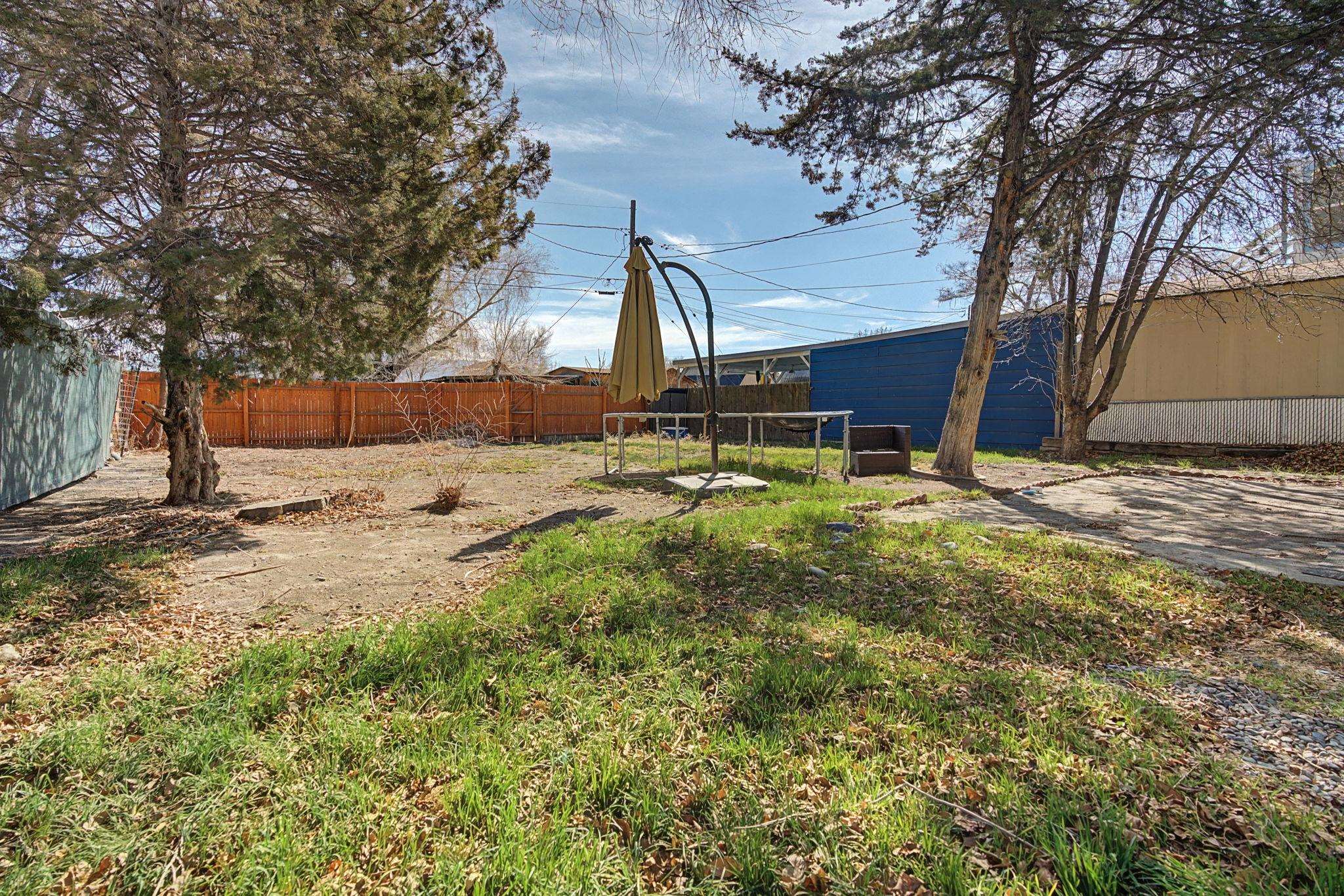 216 4th Street Clifton, CO 81520 - Photo 17 of 17 a backyard of a house with table and chairs