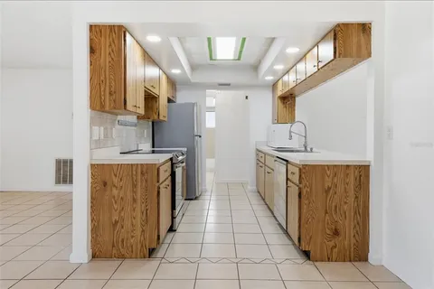 a bathroom with a sink a mirror and a bathtub