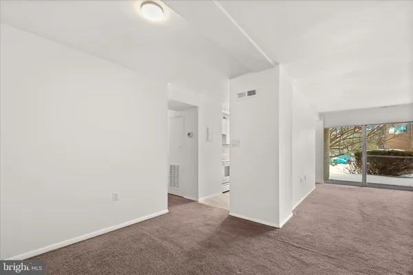 an empty room with entrance door