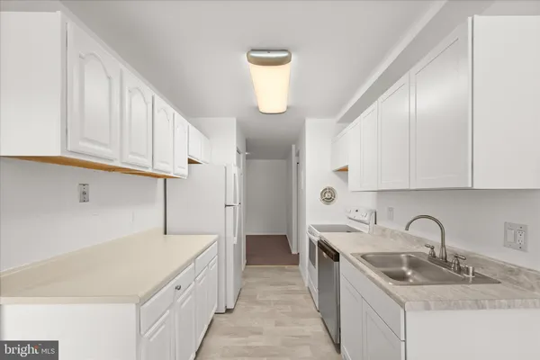 an empty room with sliding door and windows