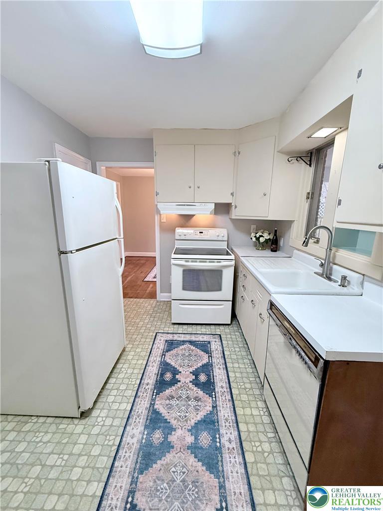 2109 Kemmerer Street Bethlehem, PA 18017 - Photo 9 of 41 a kitchen with a sink a refrigerator a washer and dryer