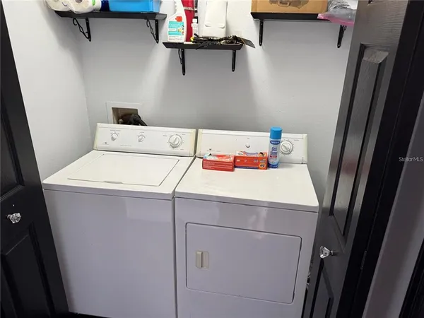 a white toilet sitting next to a shower curtain