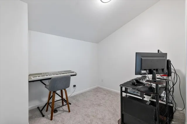 a view of a workspace with furniture