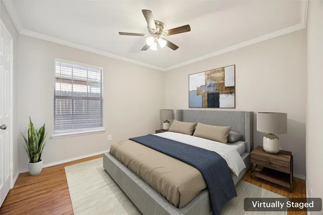 a bedroom with a large bed and a window