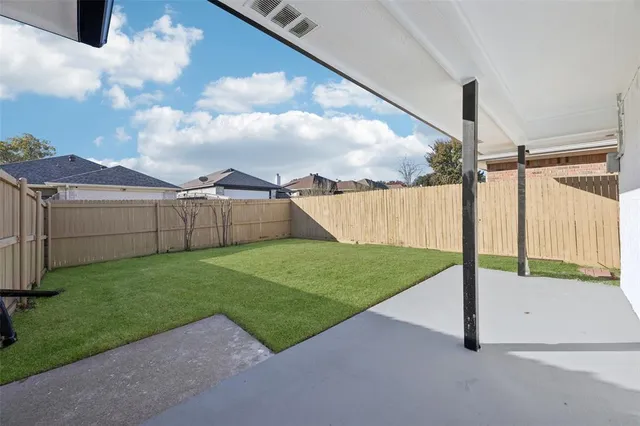 a view of a backyard with garden