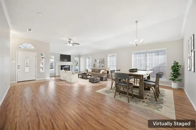 a view of a dining room with furniture and wooden floor