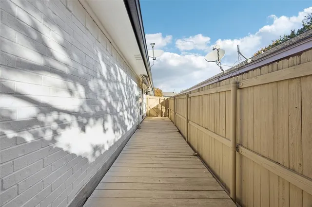 a view of balcony with wooden floor