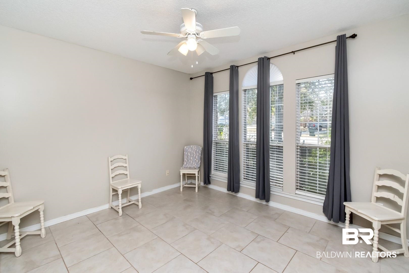 29221 Canterbury Road Daphne, AL 36526 - Photo 15 of 17 Tiled empty room with a textured ceiling and ceiling fan