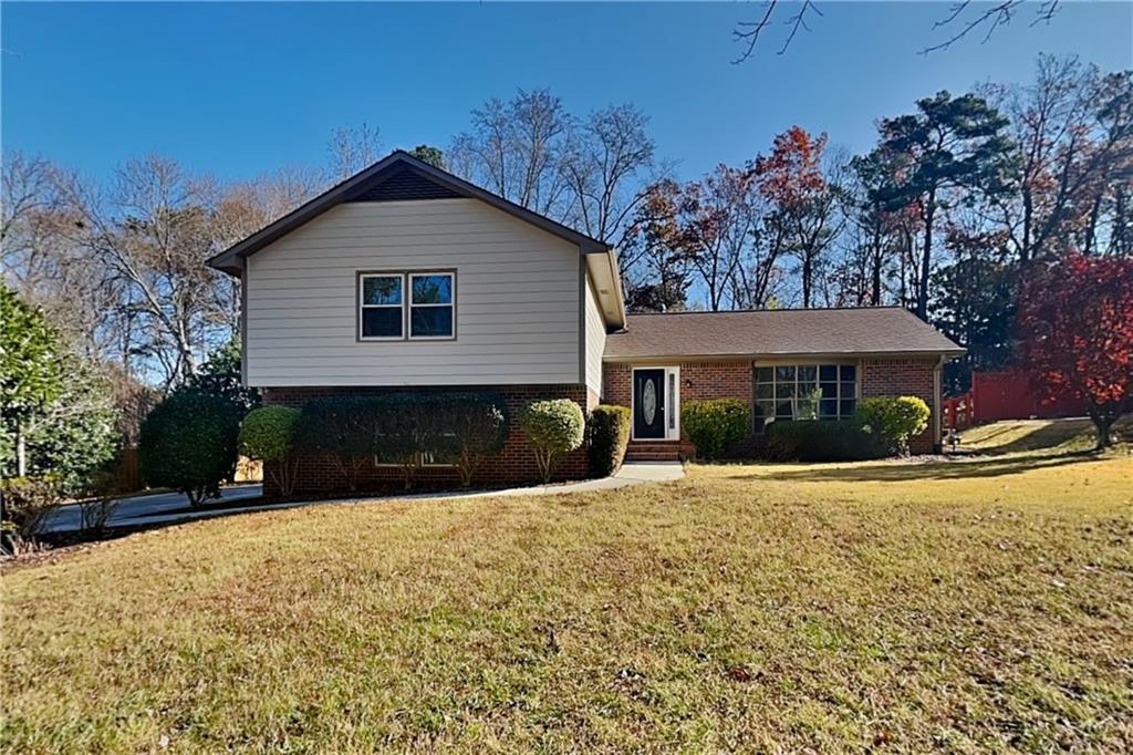 1916 Beckett Drive Marietta, GA 30062 - Photo 1 of 20 a view of a house with snow on the road