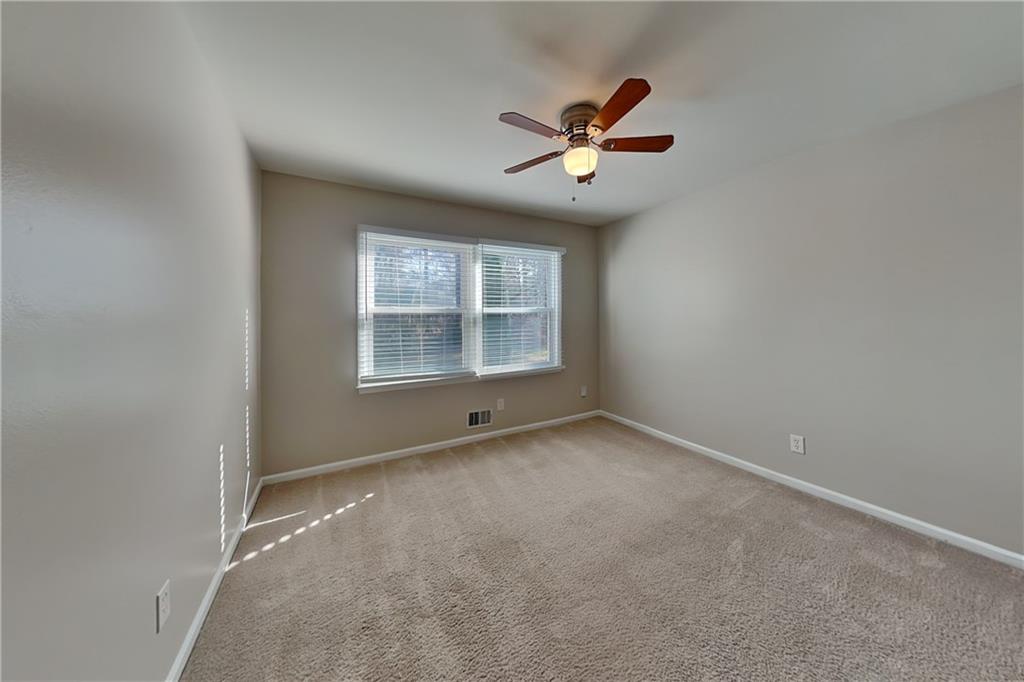 1916 Beckett Drive Marietta, GA 30062 - Photo 13 of 20 a view of an empty room with a window