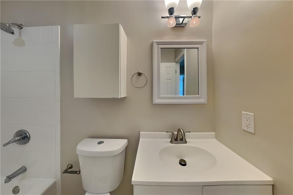 1916 Beckett Drive Marietta, GA 30062 - Photo 15 of 20 a bathroom with a sink mirror and toilet