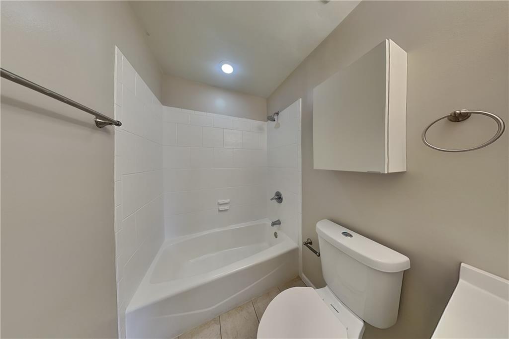 1916 Beckett Drive Marietta, GA 30062 - Photo 16 of 20 a white toilet sitting next to a bath tub