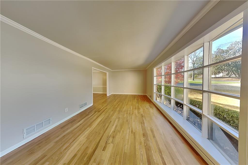 1916 Beckett Drive Marietta, GA 30062 - Photo 2 of 20 a view of a room with wooden floor and windows