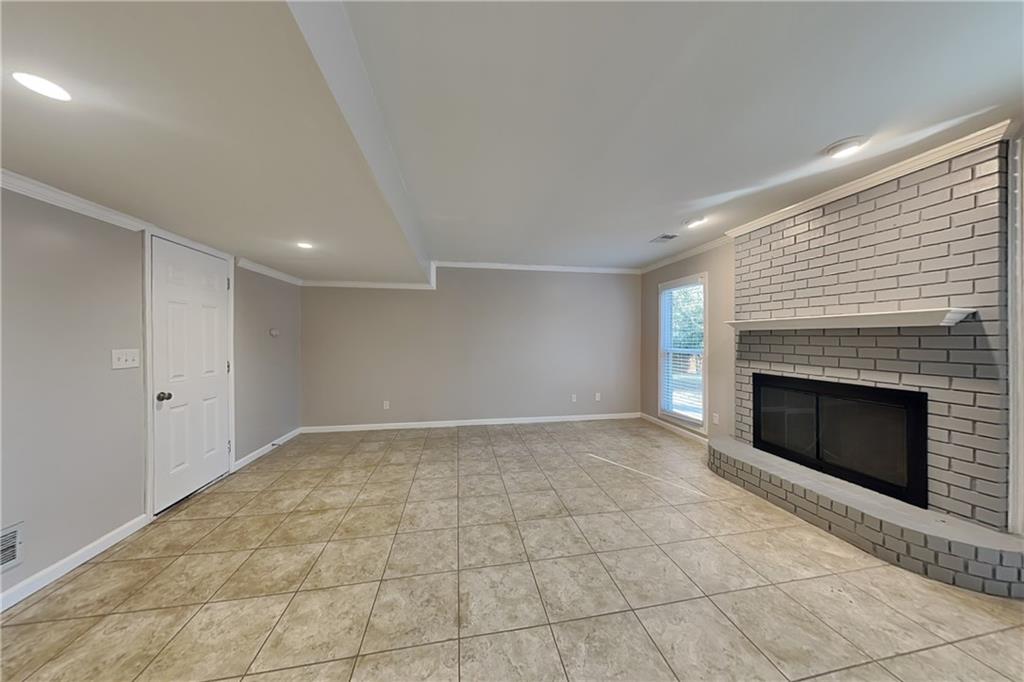 1916 Beckett Drive Marietta, GA 30062 - Photo 3 of 20 a view of an empty room with a fireplace
