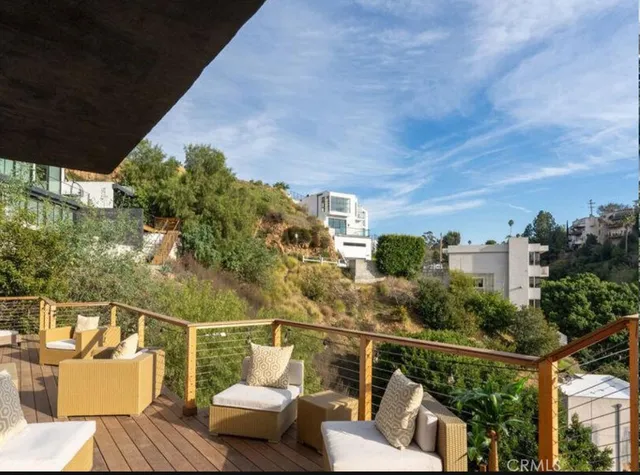 a bedroom with a large bed and a large window