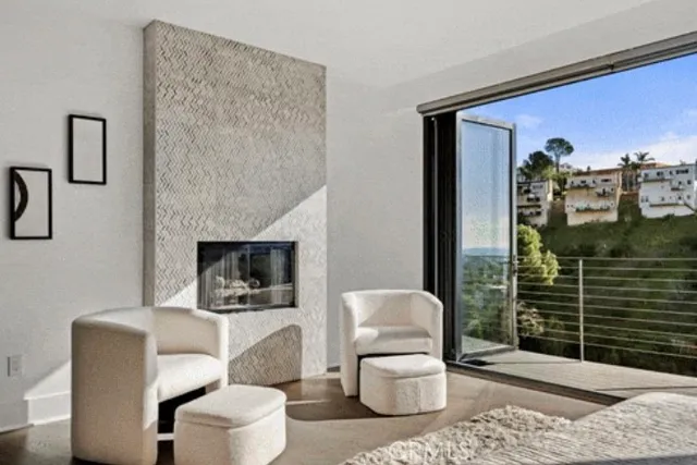 a bedroom with a large bed and a large window