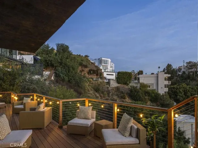 a view of roof deck with city view and mountain view