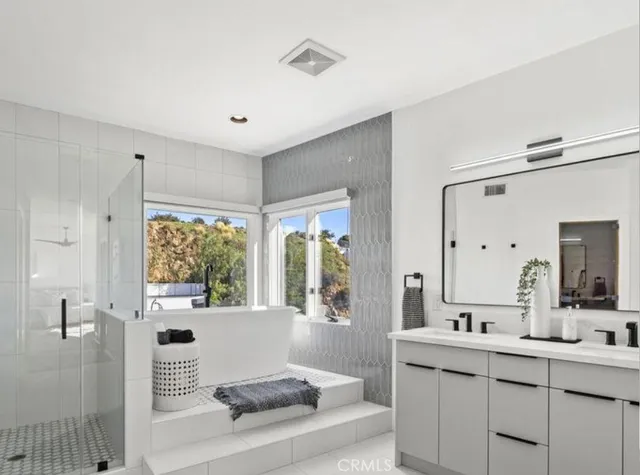 a view of a faucet a sink and a window