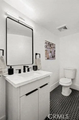 a living room with furniture a large window and a chandelier