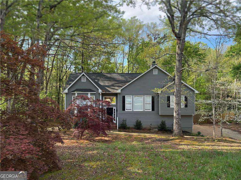 front view of a house with a yard