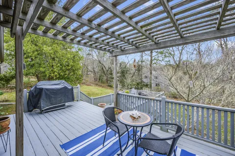 a view of a deck with a table and chairs with wooden floor