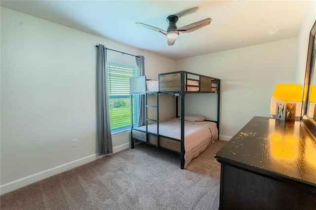 a bedroom with bed and a window