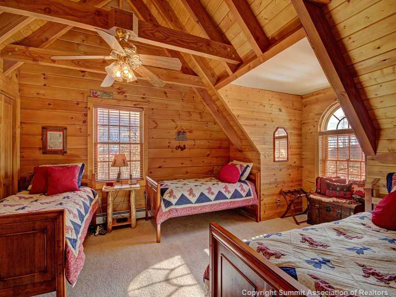 299 Sheep Ridge Road Fairplay, CO 80440 - Photo 22 of 25 a bedroom with furniture and a window
