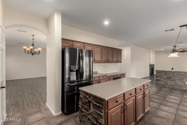 a kitchen with granite countertop a stove and a sink