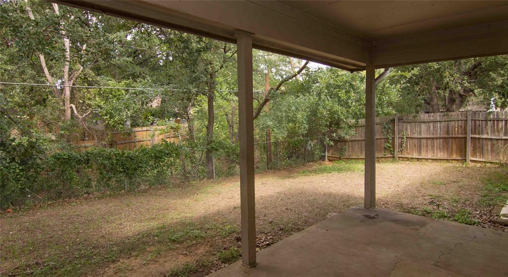 2019 West Nathan Lowe Road Arlington, TX 76017 - Photo 20 of 21 Covered patio area with concrete flooring, overlooking a fenced backyard