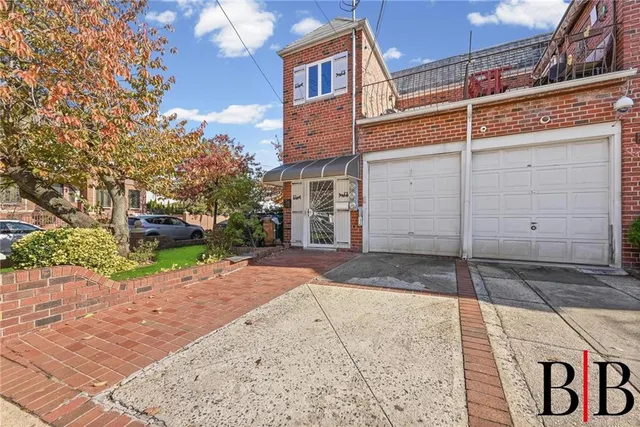 a view of a brick house with a street