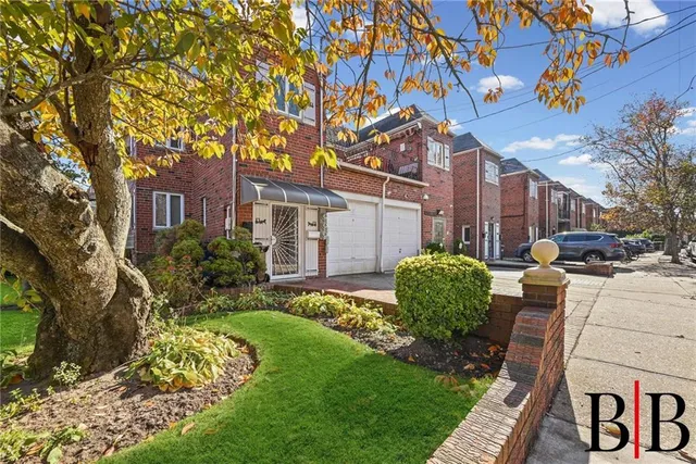 a view of a chair and table in backyard of the house
