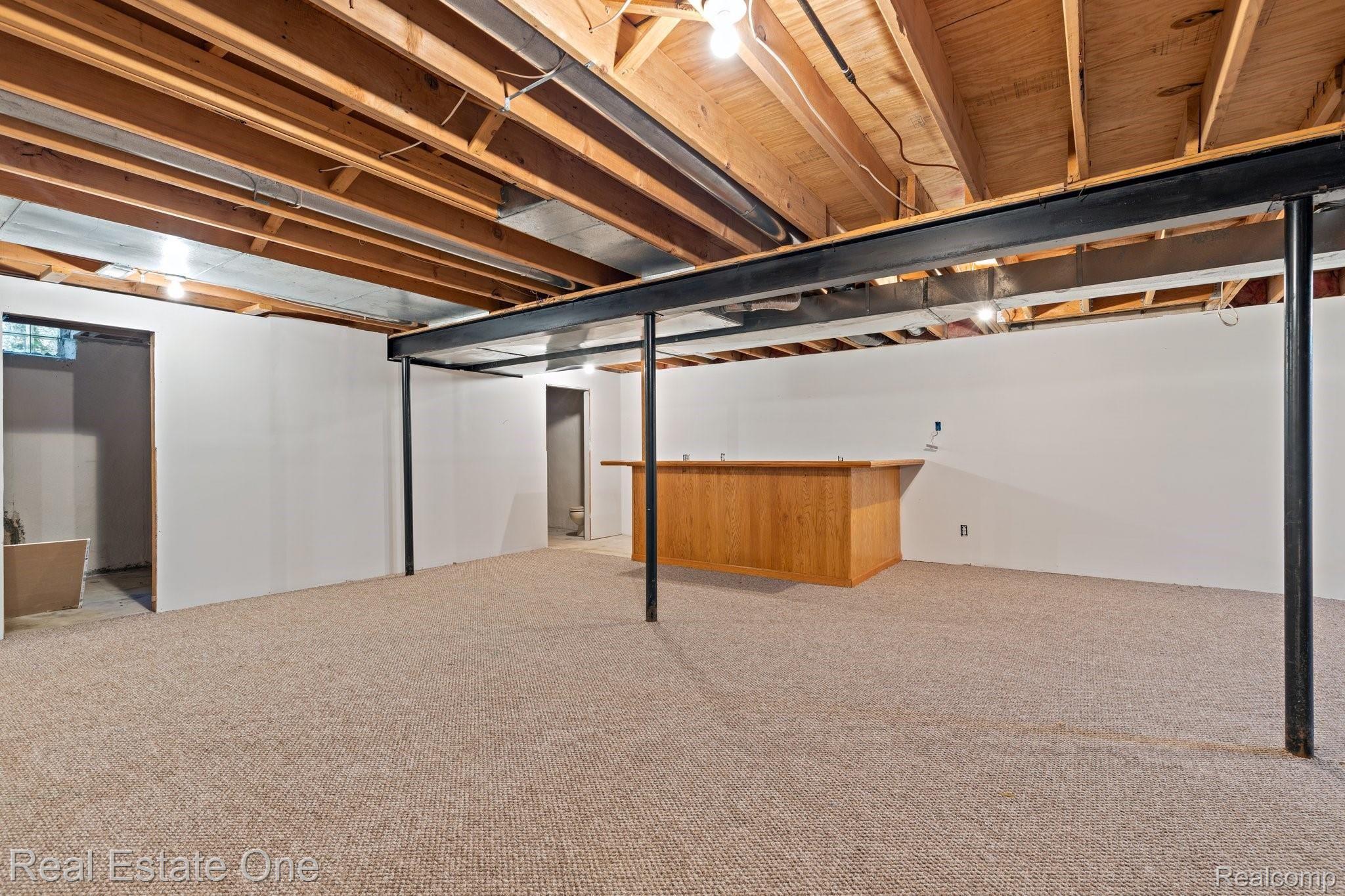 50009 Riverside Drive Macomb, MI 48044 - Photo 19 of 34 PARTIALLY FINISHED BASEMENT WITH DRY BAR & PLENT OF STORAGE SPACE