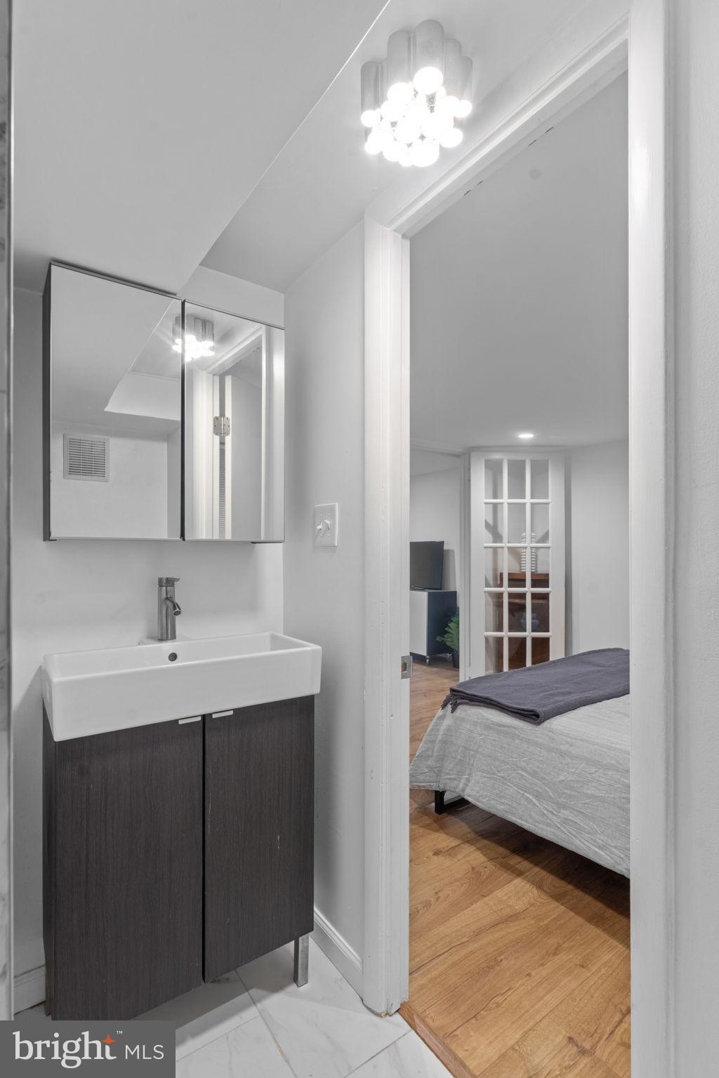 1802 Lamont Street Northwest Washington, DC 20010 - Photo 103 of 118 a en suite bathroom with a sink double vanity and a mirror