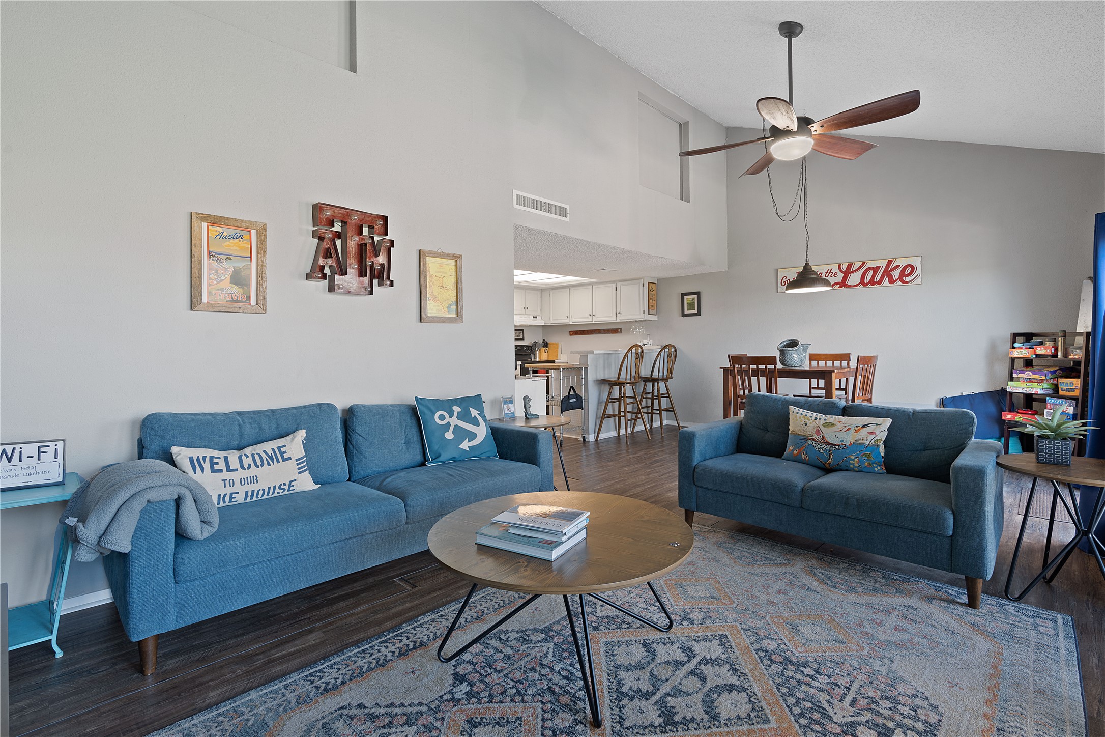 111 Comanche Drive Point Venture, TX 78645 - Photo 11 of 33 a living room with furniture and a wooden floor