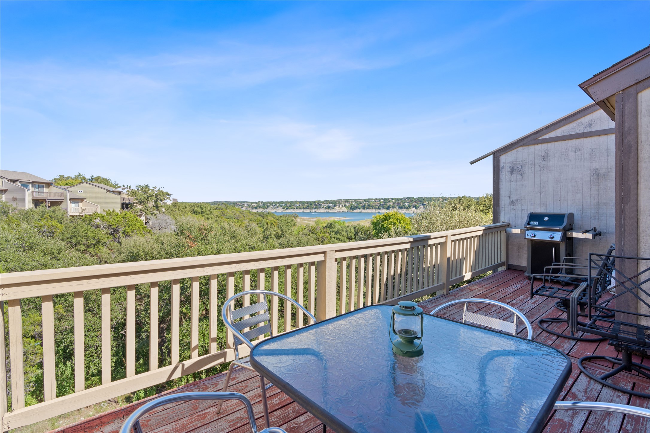111 Comanche Drive Point Venture, TX 78645 - Photo 12 of 33 a view of a balcony with chair and wooden floor