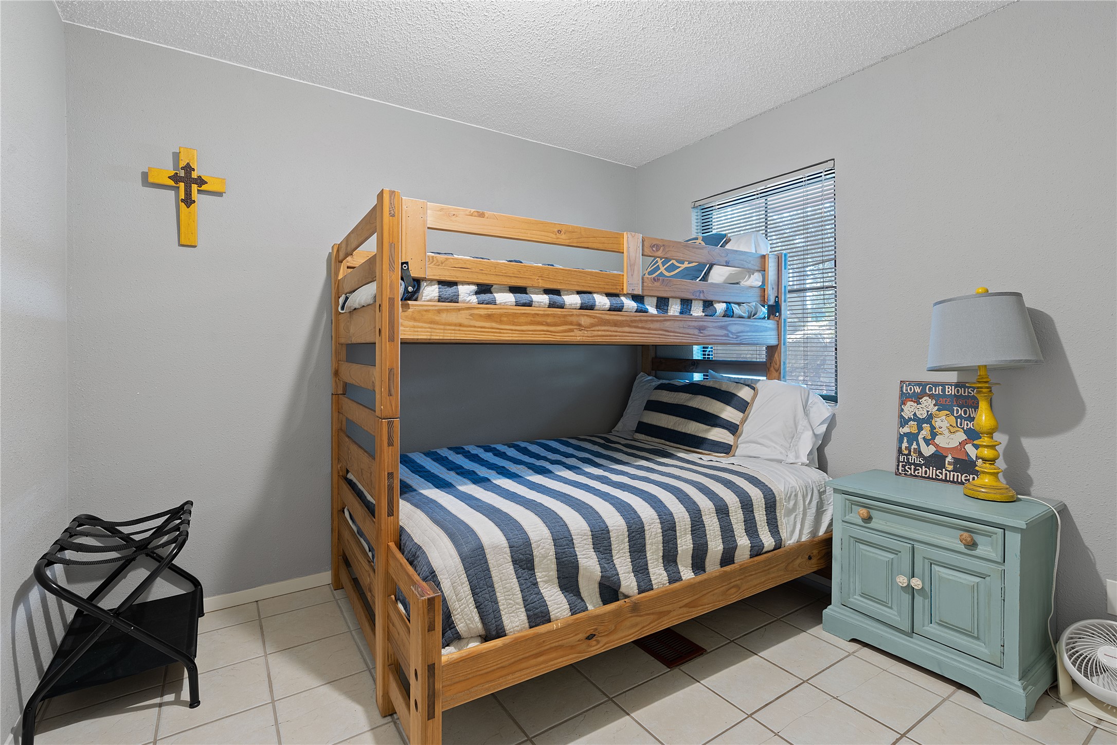 111 Comanche Drive Point Venture, TX 78645 - Photo 23 of 33 a bedroom with a bed and window