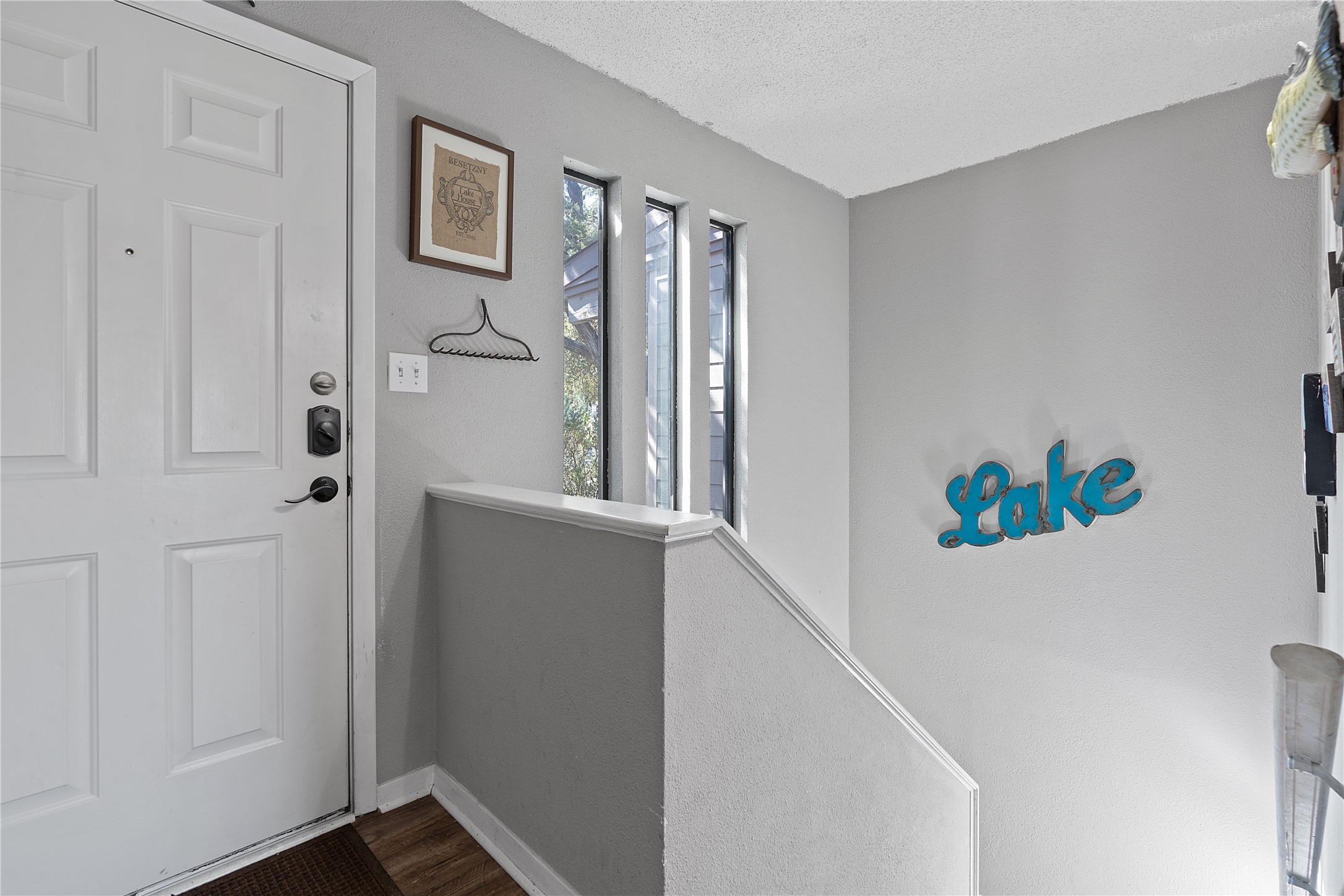 111 Comanche Drive Point Venture, TX 78645 - Photo 3 of 33 a view of an entryway with wooden floor