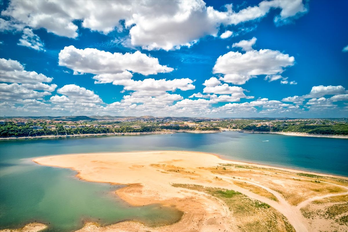111 Comanche Drive Point Venture, TX 78645 - Photo 31 of 33 a view of a lake with a city