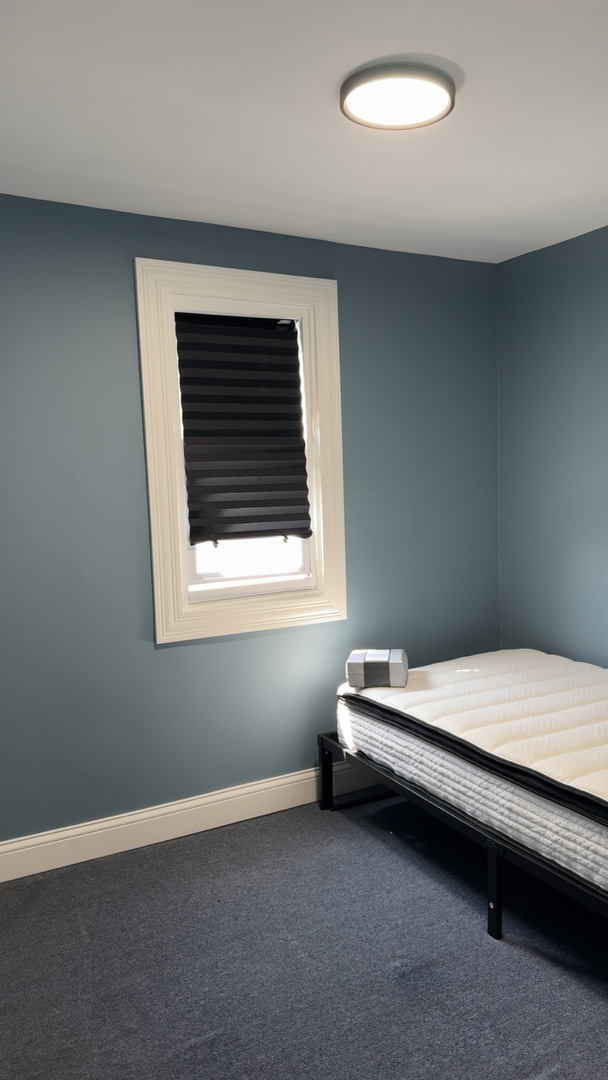 1429 South 49th Avenue, Unit 3 Cicero, IL 60804 - Photo 8 of 8 a room with a bed and a window