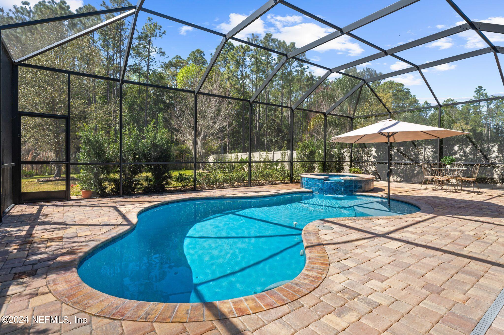206 Medio Drive St. Augustine, FL 32095 - Photo 2 of 57 a view of outdoor space swimming pool and furniture