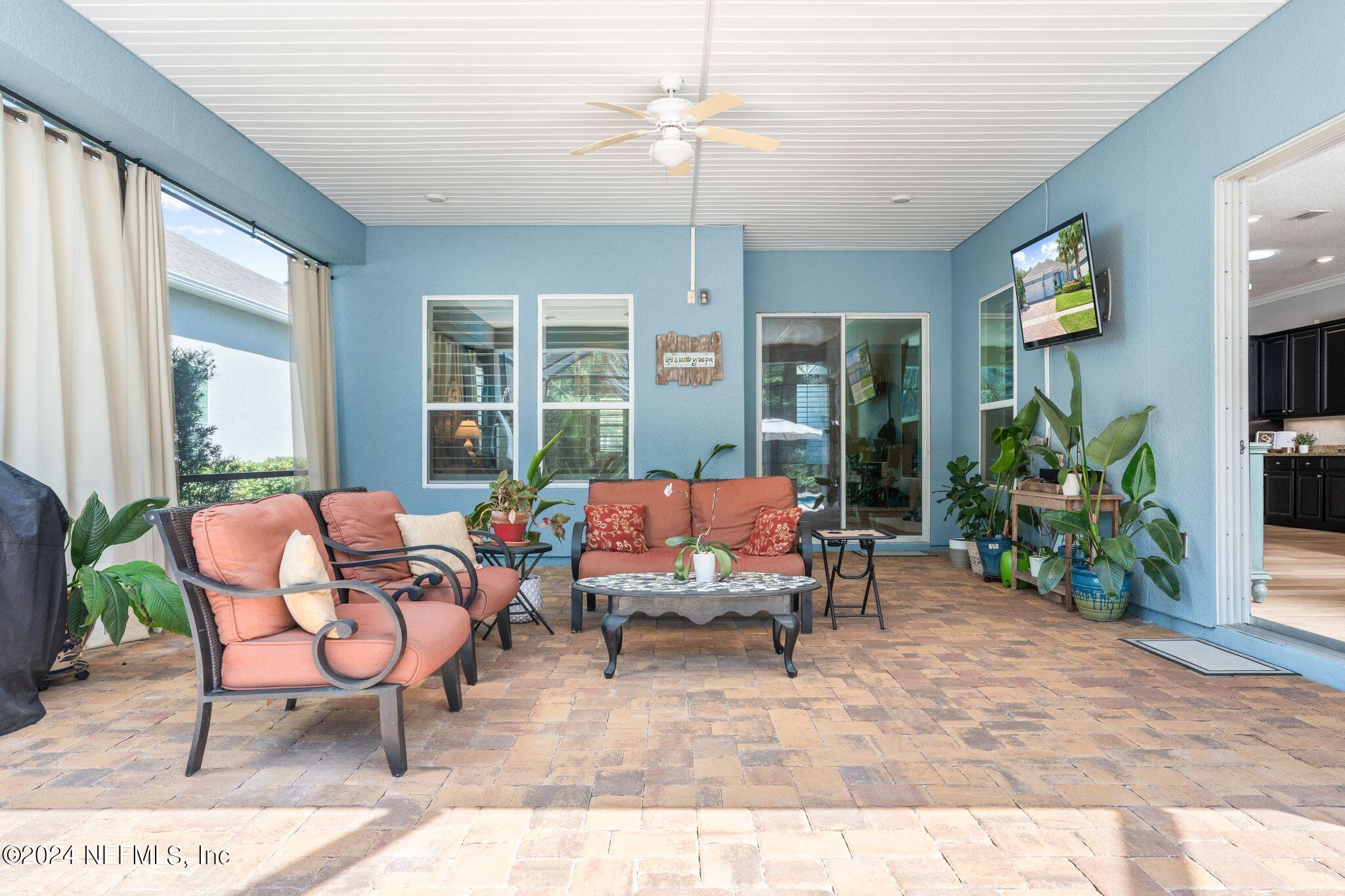 206 Medio Drive St. Augustine, FL 32095 - Photo 26 of 57 a balcony with furniture and a potted plant
