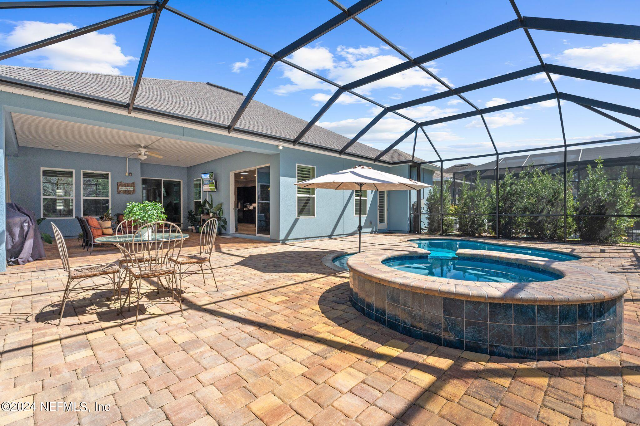 206 Medio Drive St. Augustine, FL 32095 - Photo 29 of 57 a view of a swimming pool with a patio